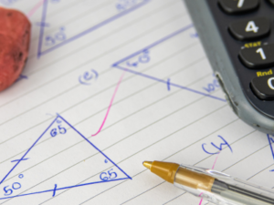 Triangles of various dimensions and a calculator.